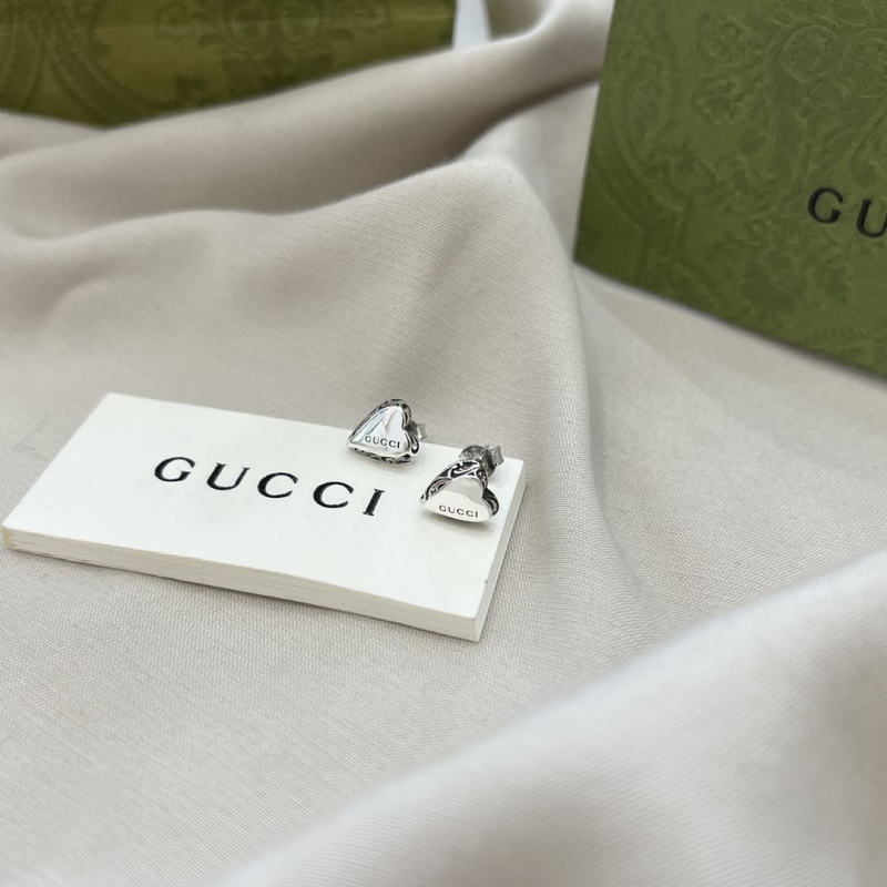 G*u*i earrings